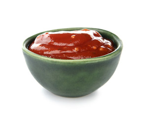 Bowl with tasty barbecue sauce on white background