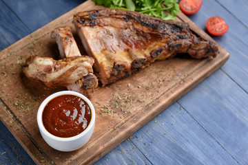 Composition with tasty barbecue sauce and meat on table