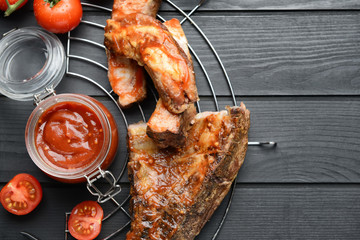 Composition with tasty barbecue sauce and meat on table