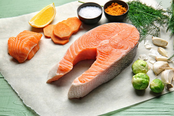 Composition with raw salmon on table