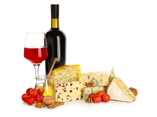 Assortment of fresh cheeses with wine on white background