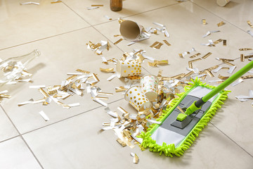 Cleaning of floor in room after New Year party
