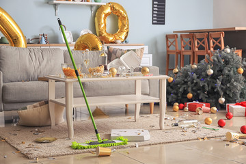 Cleaning of floor in room after New Year party