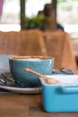 Cappuccino and Coffee with Latte Art and Thick Cream and Sugar On A Wooden Table In South Africa 