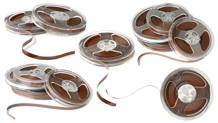 Isolated magnetic tapes. Collection of vintage reels of audio magnetic tape isolated on white...