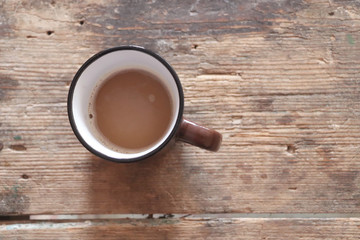 Cup of coffee on wooden table