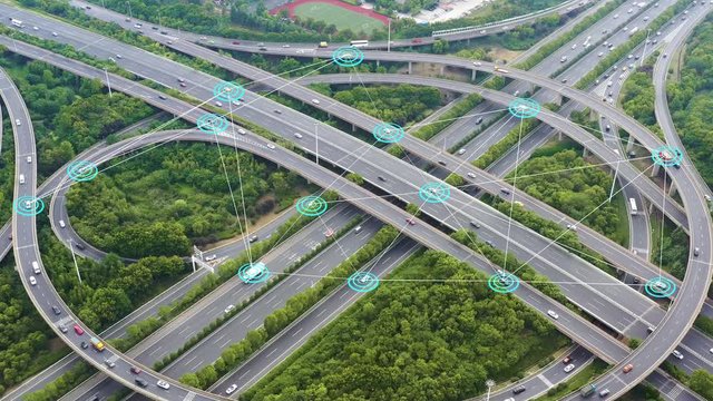 Aerial view of road junction with moving cars,Autopilot concept.Aerial view of road junction with moving cars,Autopilot concept.