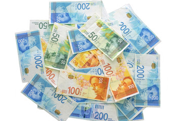 Israeli money stack of the new Israeli money bills (banknotes) of 200, 100, 50 shekel isolated on a white background. New Israeli Shekel series C.   