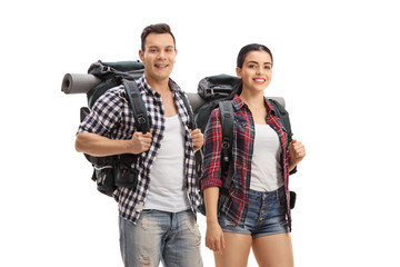 Fototapeta premium Hikers with backpacks standing and looking at the camera