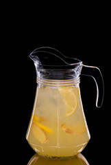 Pitcher with lemon lemonade and ginger
