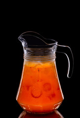 Pitcher with sea buckthorn lemonade with ice