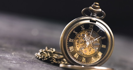 Antique old pocket watch dial close-up. Vintage hipster clock measuring time. - Powered by Adobe
