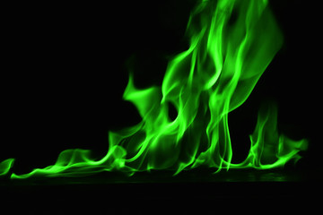 Beautiful fire green flames on a black background.
