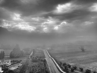 Aerial view street in the fog, Tuscany