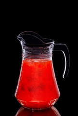 Pitcher with lemonade made of raspberry and maracuya