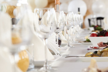 A luxurious covered table for the holiday in an expensive restaurant.	