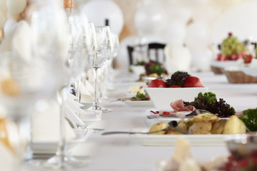 A luxurious covered table for the holiday in an expensive restaurant.	