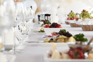 A luxurious covered table for the holiday in an expensive restaurant.	