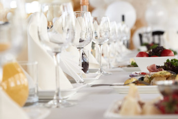 A luxurious covered table for the holiday in an expensive restaurant.	