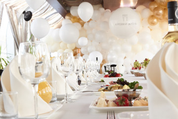 A luxurious covered table for the holiday in an expensive restaurant.	