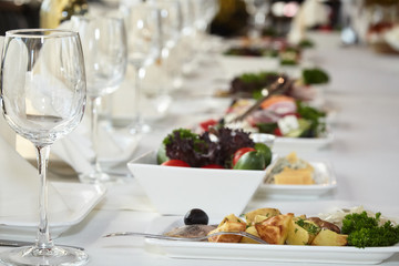 A luxurious covered table for the holiday in an expensive restaurant.	
