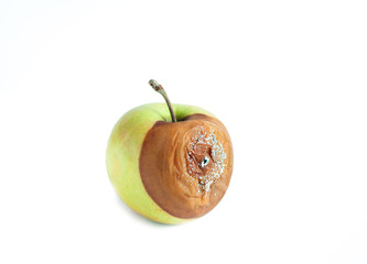 Ugly rotten green apple isolated on white background