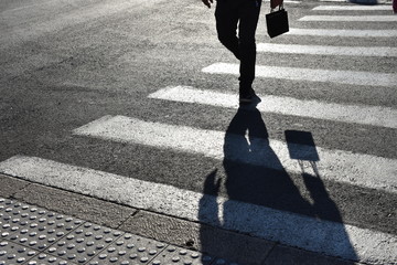 Black and white shadows on zebra crossing. Shadows on the asphalt crosswalks