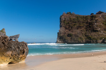 Atuh Beach With Famouse Rock Island Outcrop and Natural Arch Carved By The Bright Turquoise Ocean on Nusa Penida, Bali, Indonesia