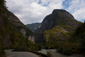 Fototapeta na wymiar Abkhazia. Jeep trip to the mountains. The Gega waterfall, lake Riza
