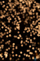 Background from christmas garlands glowing in defocus.