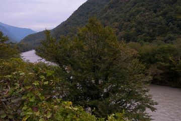 Naklejka premium Abkhazia. Jeep trip to the mountains. The Gega waterfall, lake Riza
