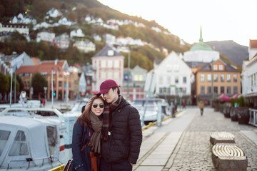 Obraz na płótnie Canvas Couple of love is enjoying travel in Bergen, Norway