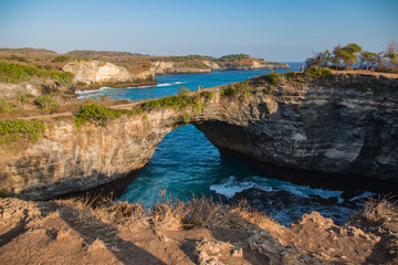 Fototapeta na wymiar Broken Beach Natural Arc Carved By Turquoise Ocean Water on Nusa Penida, In Bali, Indonesia