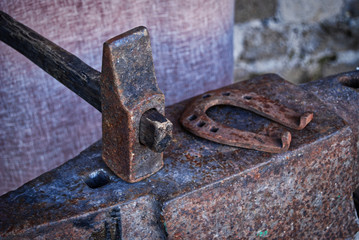 Hammer and anvil in a blacksmith's workshop