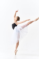 young ballet dancer posing on white background