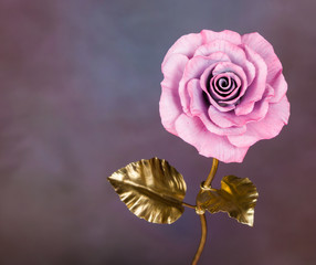 pink metal rose as symbol of eternal love