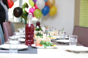 served table for children's birthday, reserved table, children's menu, selective focus