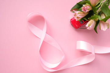 Obraz na płótnie Canvas Pink ribbon in the shape of a eight