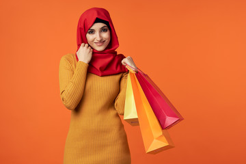 young woman with shopping bags