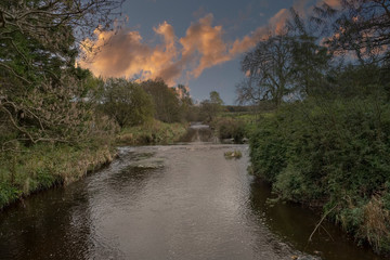 Scotlands Parks and a Gentle Flowing River with Reflections on the Water.