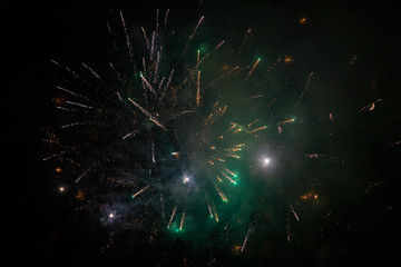 Fototapeta premium Amazing green fireworks on night sky. New years eve celebration. Ceske Budejovice, Czech republic