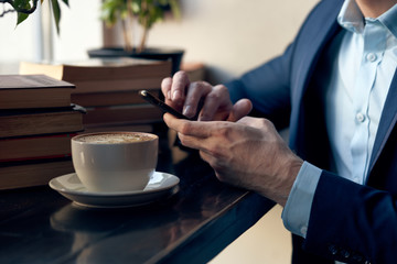 hands holding a cup of coffee