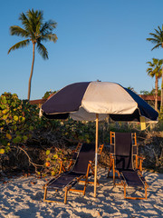 chairs and umbrella on tropical beach