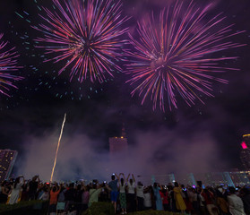 Crowd of tourism join New Year celebration with bueatiful firwork show, Crowd watching fireworks and celebration