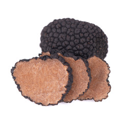 Black truffles isolated on a white background. Fresh sliced truffle. Delicacy exclusive truffle mushroom. Piquant and fragrant French delicacy. Clipping path.