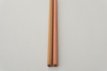 Brown pencil on white background