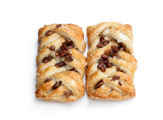 Flaky pastry filled with maple syrup and topped with pecan isolated on white