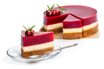 Delicious layered cranberry cheese cake isolated on white