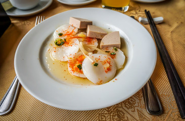 Vietnamese steamed water fern cakes filled with dried shrimps, crisky pork skin, scallion oil served with fish sauce.Local name is 'banh beo'. It's a favorite meal and very popular street food.