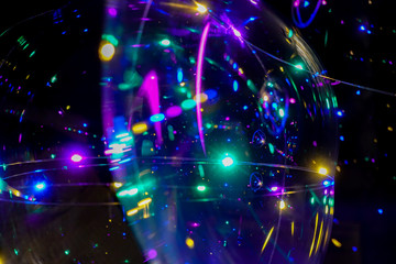 Colored lights on a dark background. Abstract dark background. Space emulation